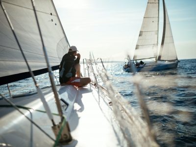 Young handsome man relaxing on his sailboat